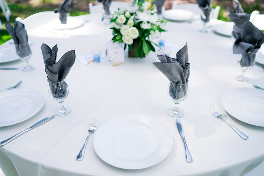 Dark grey and white table linens.